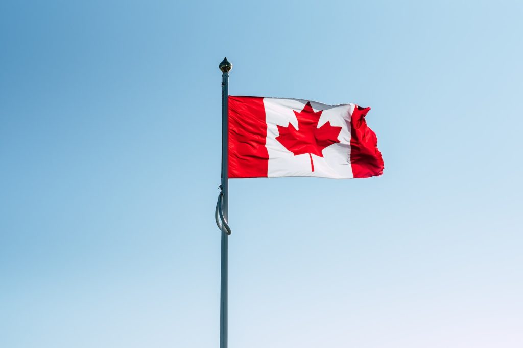 Canada flag on pole during daytime